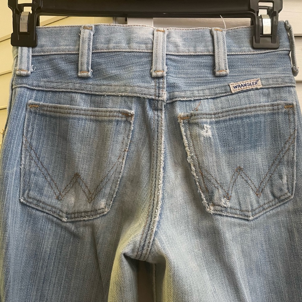 Thrashed and destroyed 1970’s Wrangler Faded Blue bell bottomed Jeans size 25”